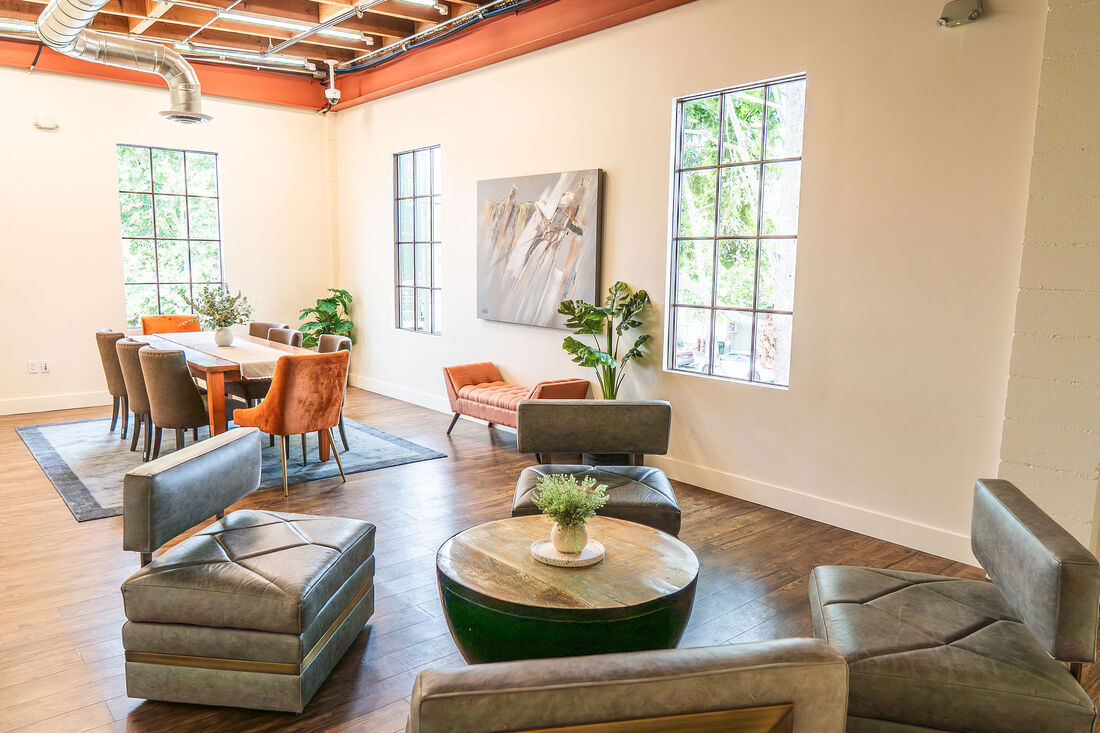Lounge area with leather seating and dining table
